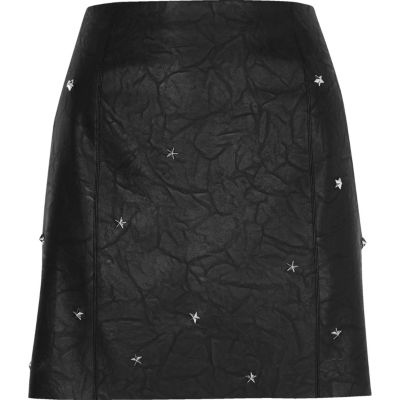 Black faux leather studded mini skirt